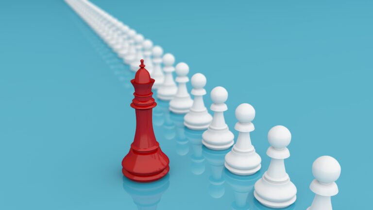 white pawn chess pieces with a red king representing Preparing for the Spring Property Market