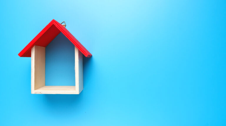 red and white house outline on blue background