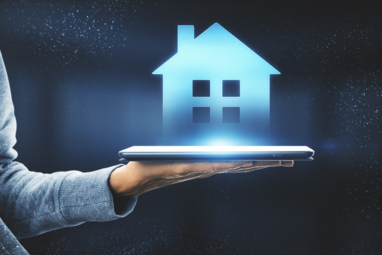 side view of a hand holding a digital device with a house image showcasing AI visibility for property professionals and estate agents